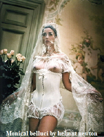 monica belluci, in lace basque , bridal image ,  photograph by helmut newton